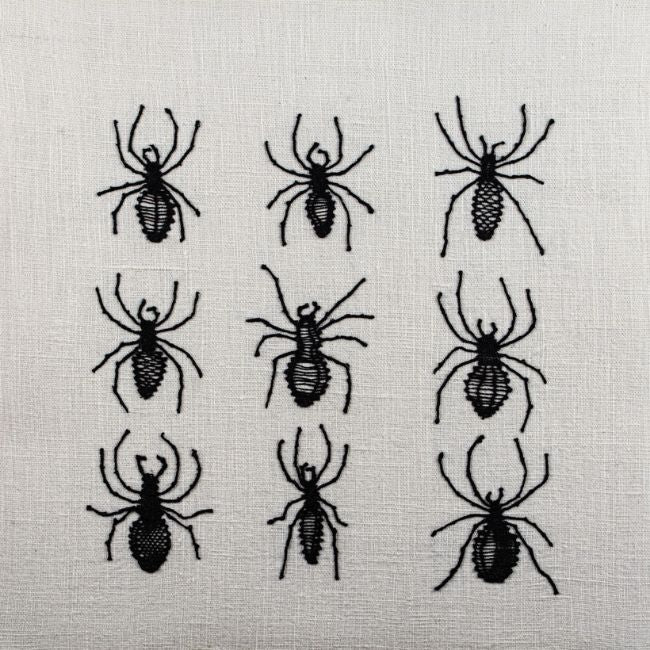Ants made with bobbin lace textile art. by Caroline Le Calvar